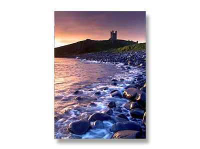 Dunstanburgh Castle at dawn, Northumberland - Click to view or buy this customisable greeting card